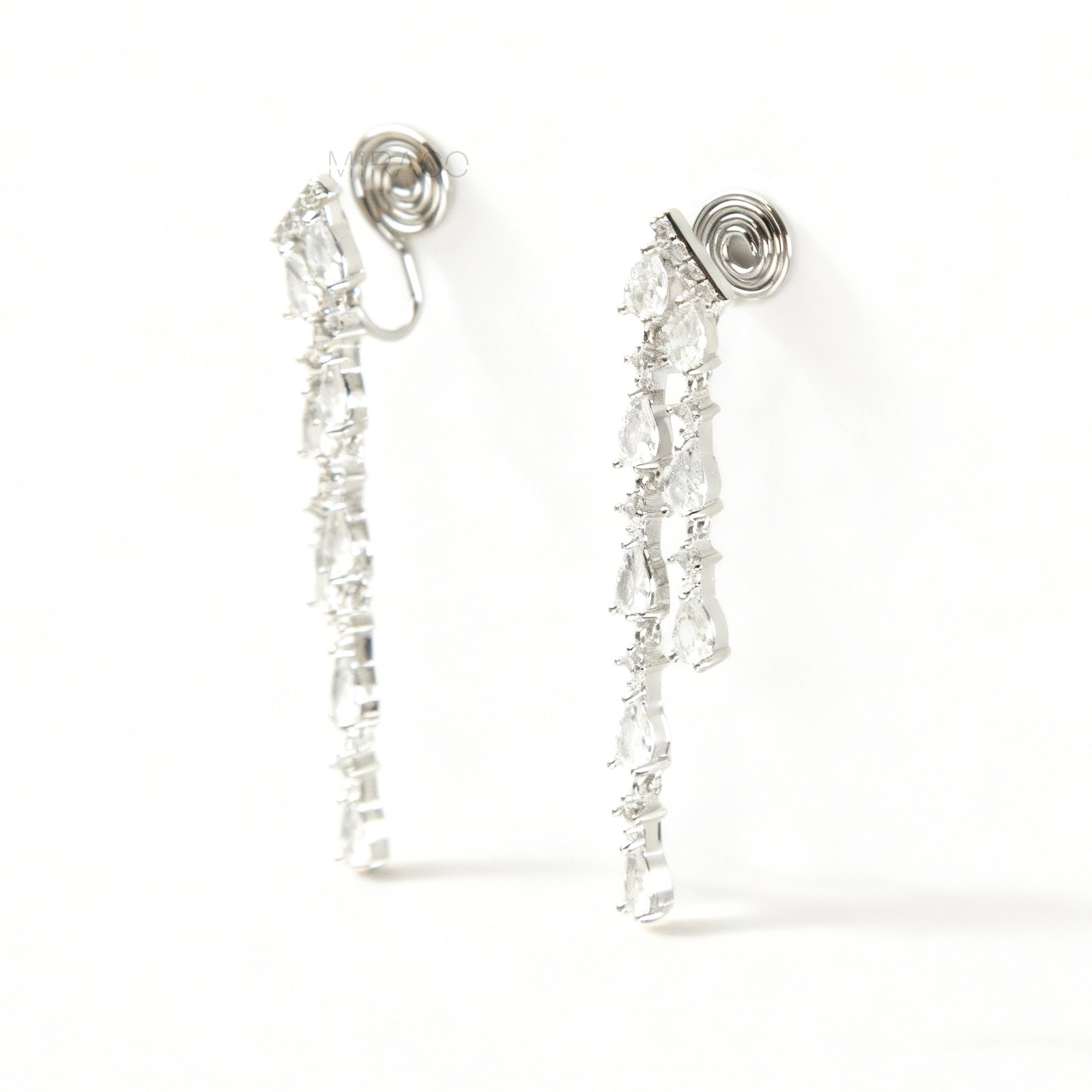 Long, silver-tone dangle clip-on earrings featuring cascading strands of clear (white) and pink pear-shaped and round-cut cubic zirconia stones.