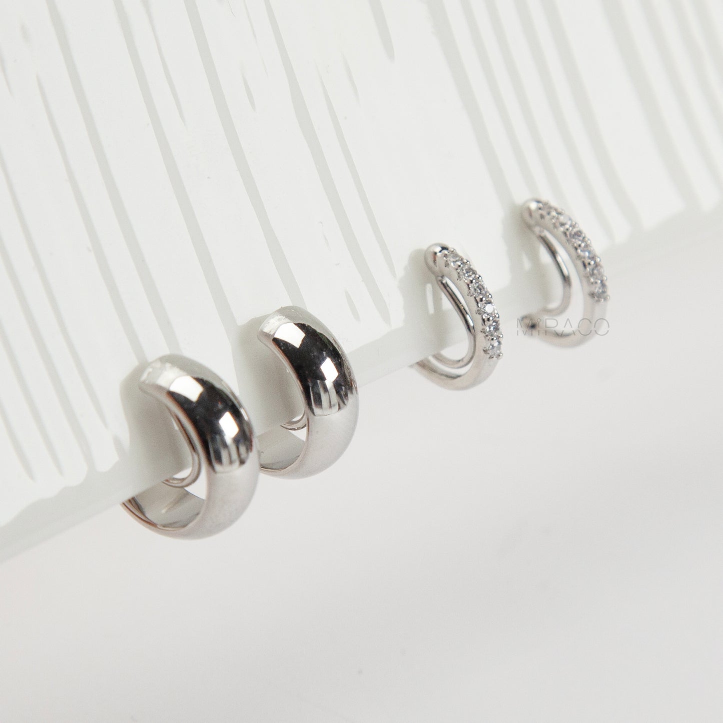 Silver minimalist clip-on hoop earrings set with two simple hoop styles for non-pierced ears.