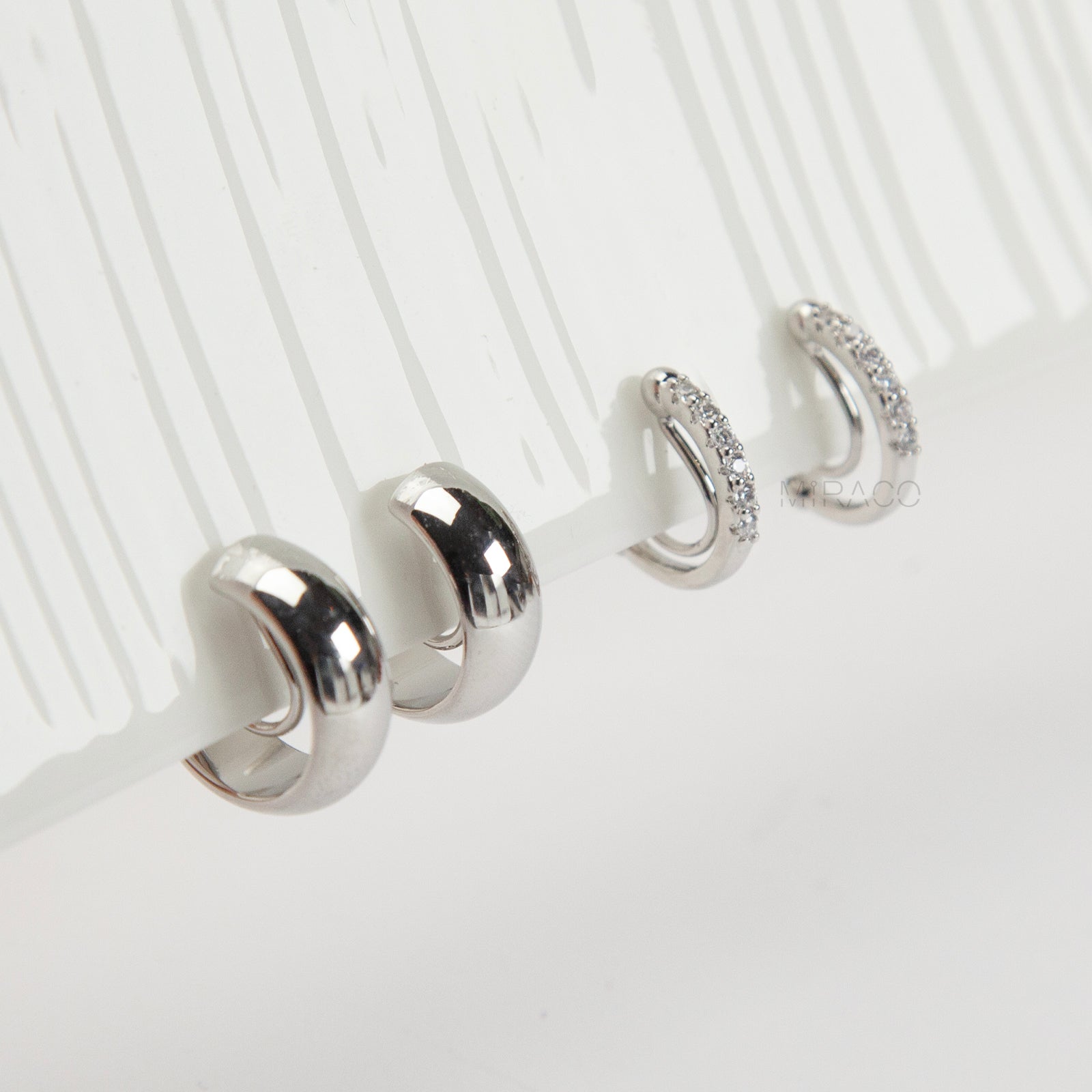 Silver minimalist clip-on hoop earrings set with two simple hoop styles for non-pierced ears.