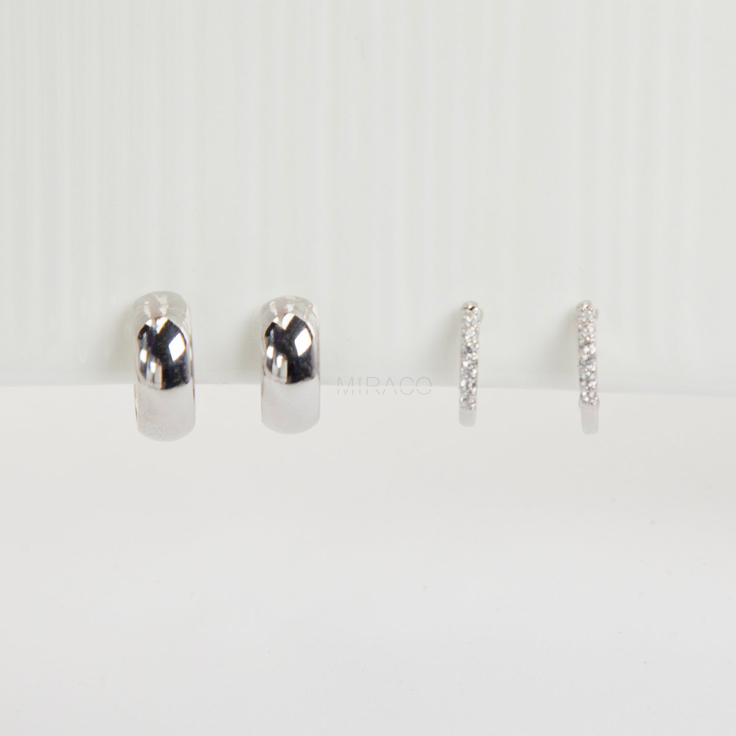 Silver minimalist clip-on hoop earrings set with two simple hoop styles for non-pierced ears.
