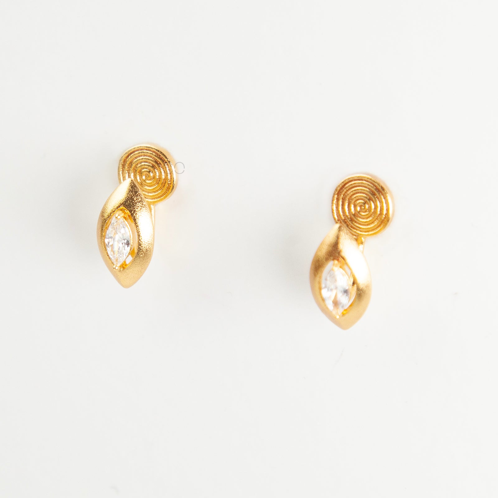 small gold-tone clip-on stud earring  featuring a marquise-cut clear gem.