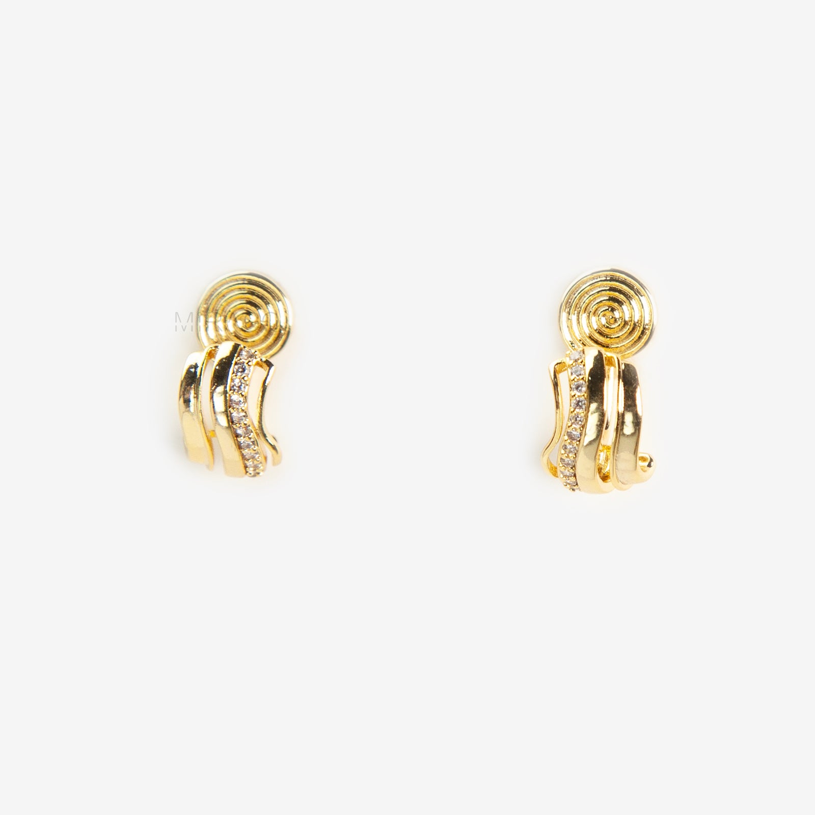 Close-up of gold-tone clip-on earrings featuring a modern stacked band design with a row of small clear crystals and a spiral coil-back.