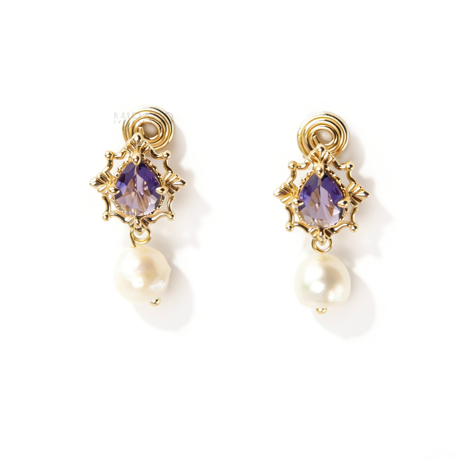Pair of gold-plated, coil-back clip-on earrings with an ornate Victorian-style setting holding a purple pear-cut gemstone (amethyst color) and a dangling real baroque freshwater pearl.