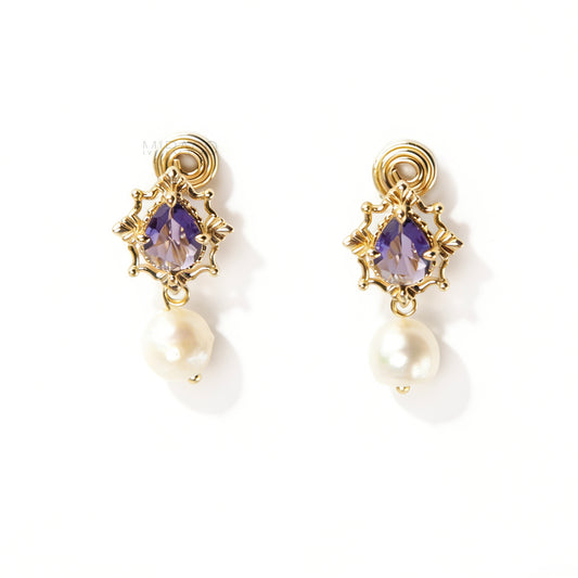 Pair of gold-plated, coil-back clip-on earrings with an ornate Victorian-style setting holding a purple pear-cut gemstone (amethyst color) and a dangling real baroque freshwater pearl.