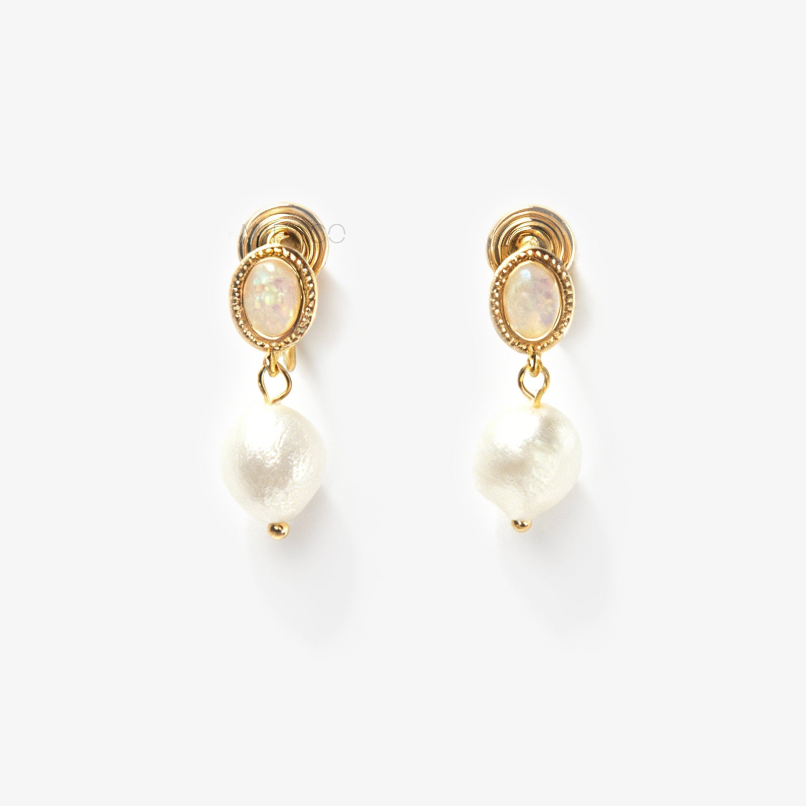 Pair of gold-tone, coil-back clip-on earrings with an oval, bezel-set iridescent opal-effect stone and a dangling real, irregularly shaped baroque freshwater pearl.