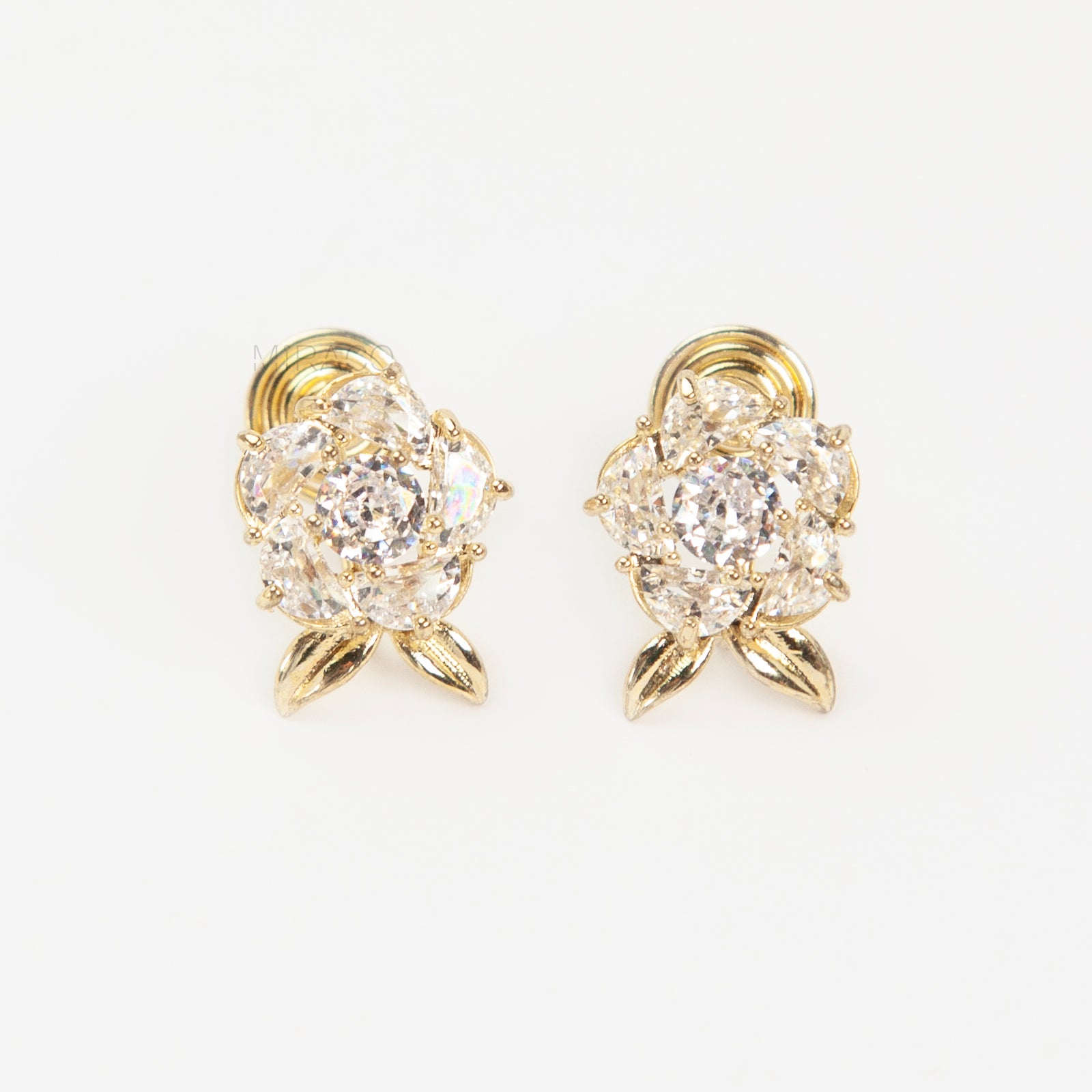 Pair of elegant gold-tone clip-on stud earrings shaped like a fully bloomed rose flower, set with a cluster of round and marquise-cut cubic zirconia stones, with a coil back clasp.