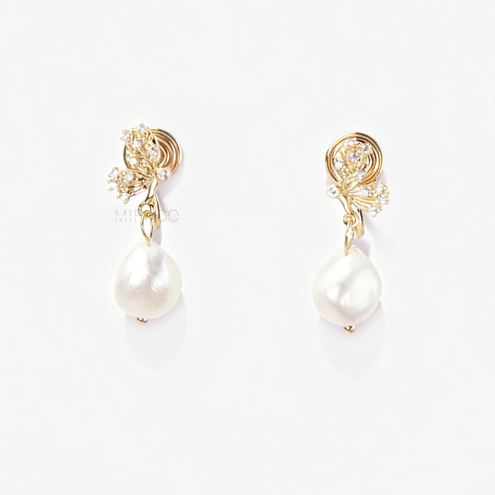 Pair of elegant gold-tone clip-on earrings with a CZ-encrusted butterfly swirl top and a dangling, lustrous white Baroque pearl drop, secured with a comfortable coil back clasp.