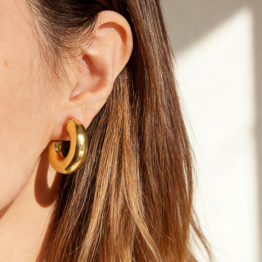 Gold chunky hoop clip-on earrings with polished finish and clear comfort clip for non-pierced ears