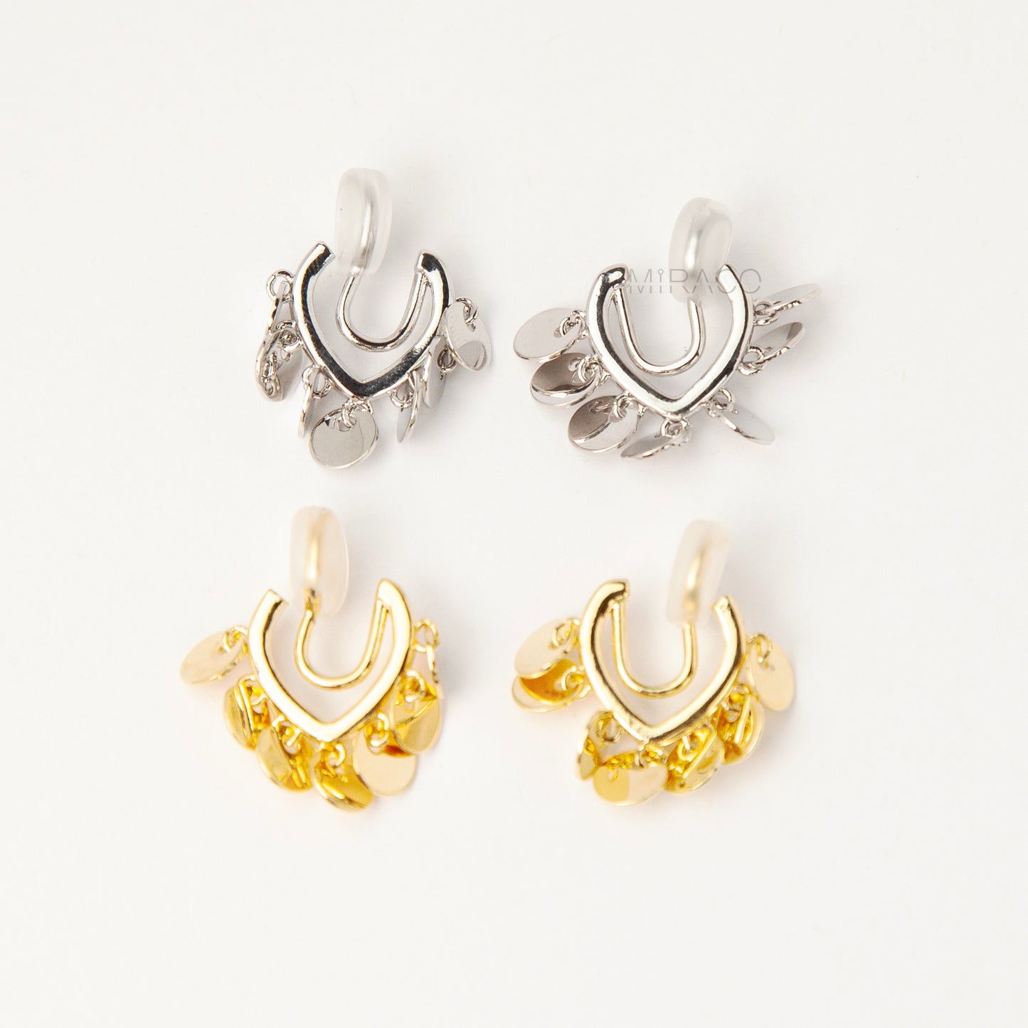 Gold and silver U-shaped clip-on earrings with dangling coin charms and comfortable coil back design for non-pierced ears