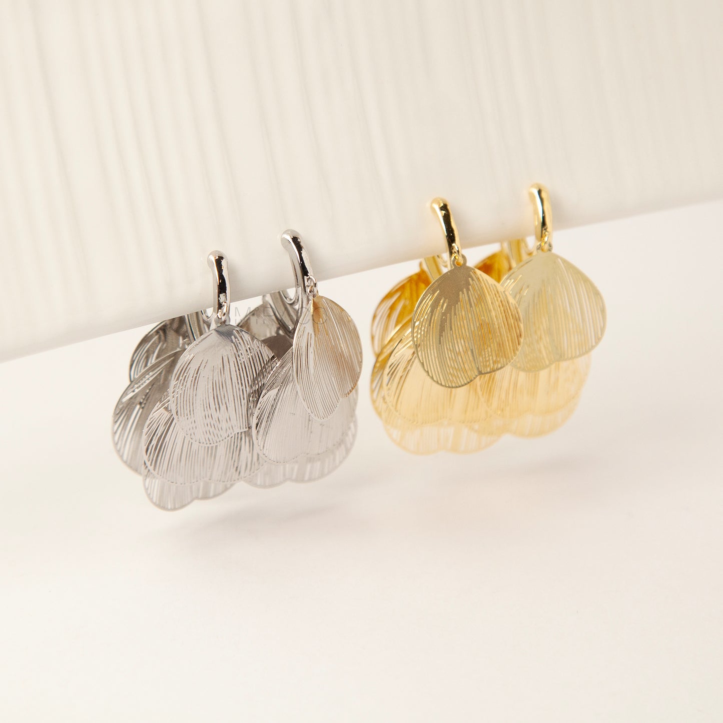 Gold and silver layered petal clip-on earrings with textured fan-shaped charms and comfortable coil back for non-pierced ears