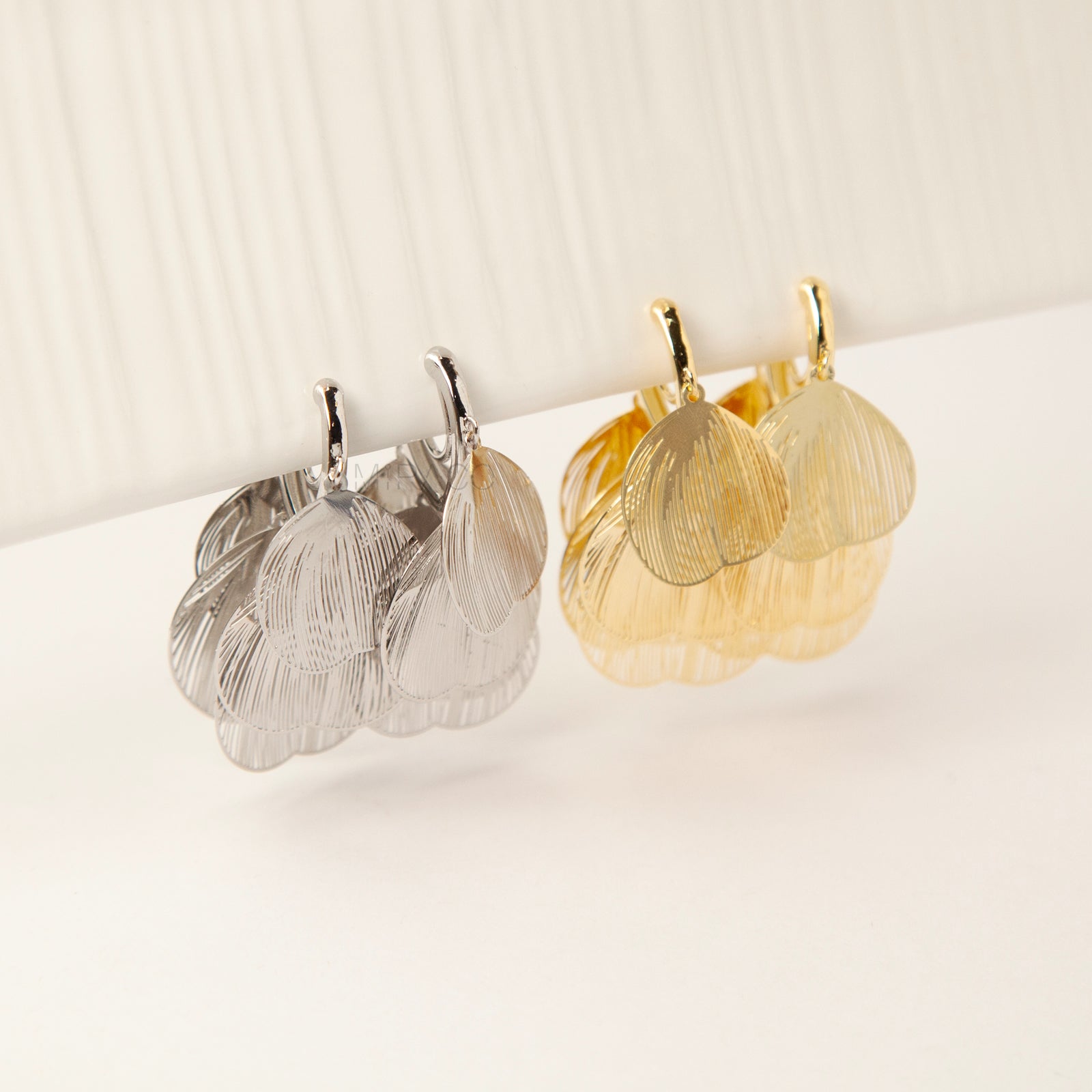 Gold and silver layered petal clip-on earrings with textured fan-shaped charms and comfortable coil back for non-pierced ears