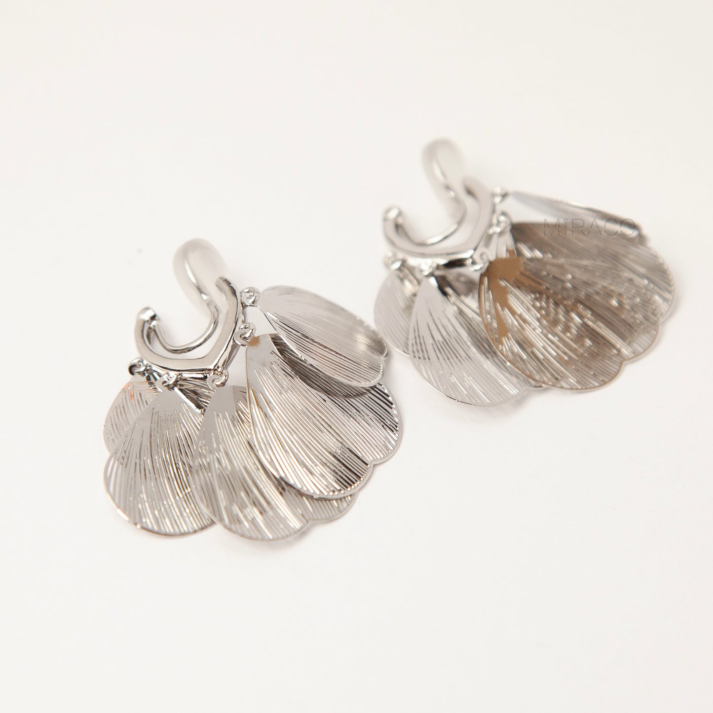 silver layered petal clip-on earrings with textured fan-shaped charms and comfortable coil back for non-pierced ears