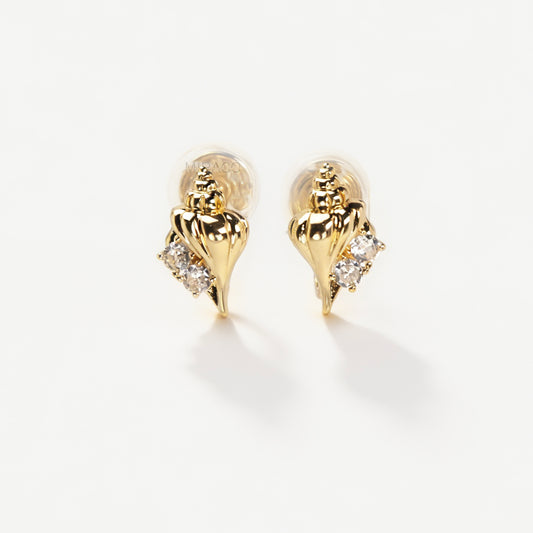 Pair of small gold-tone conch seashell clip-on earrings accented with clear crystals and featuring comfortable invisible coil back closures.