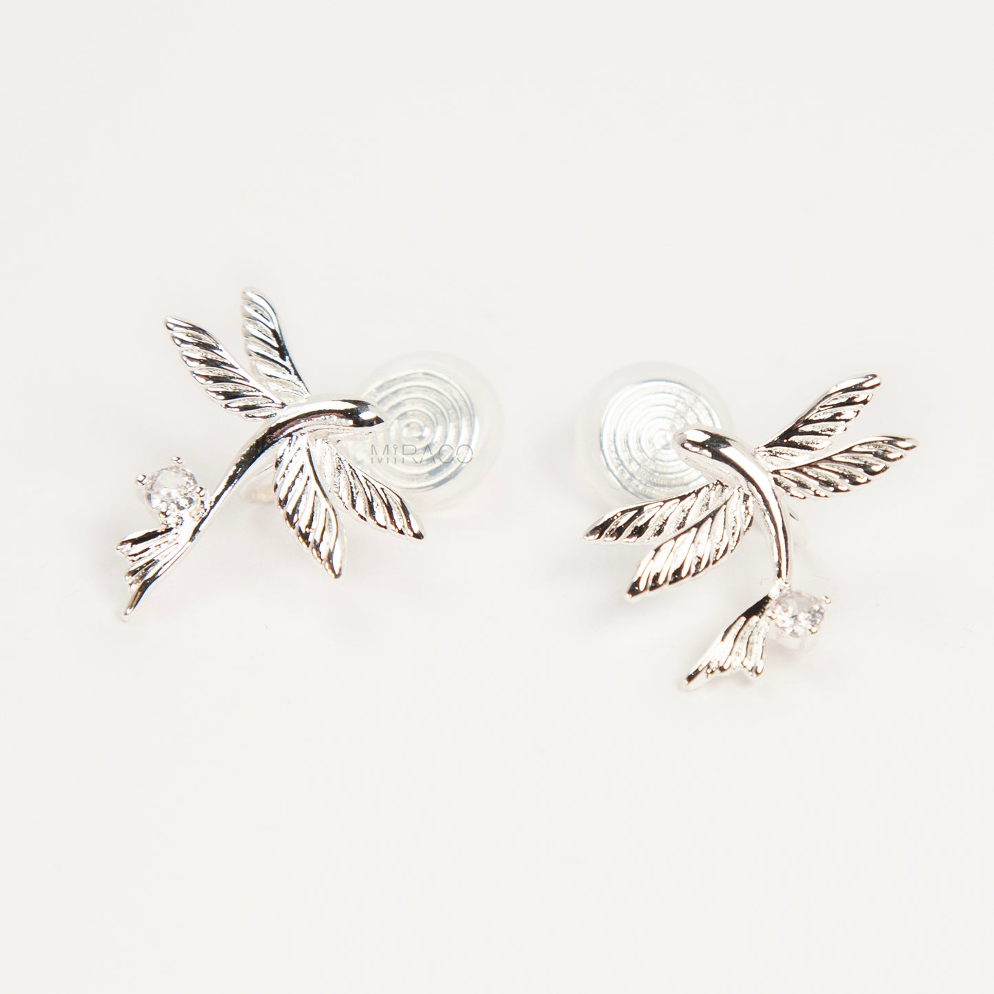 Pair of silver-tone bird-shaped clip-on earrings in flight with clear crystals and comfortable invisible coil back closures.