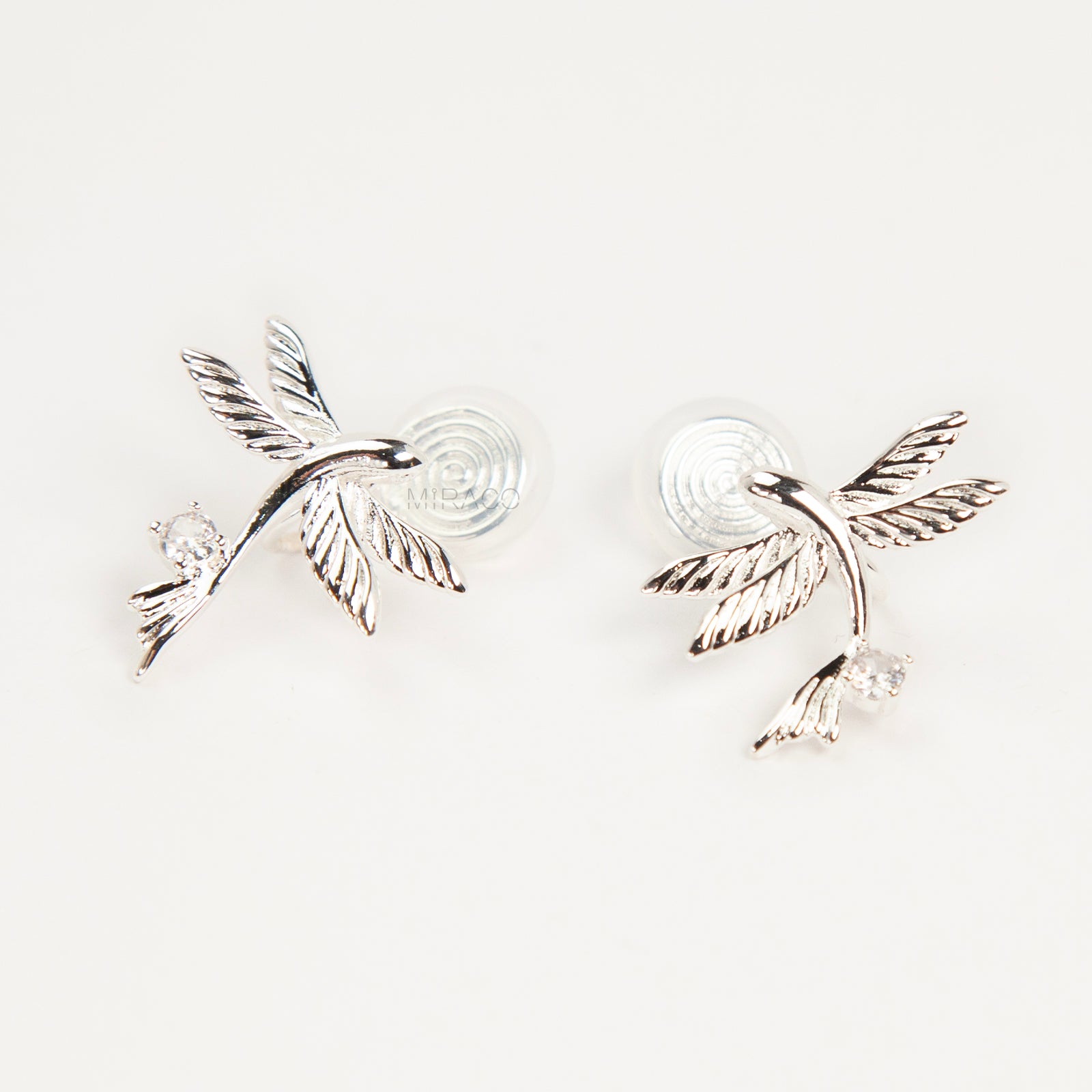 Pair of silver-tone bird-shaped clip-on earrings in flight with clear crystals and comfortable invisible coil back closures.