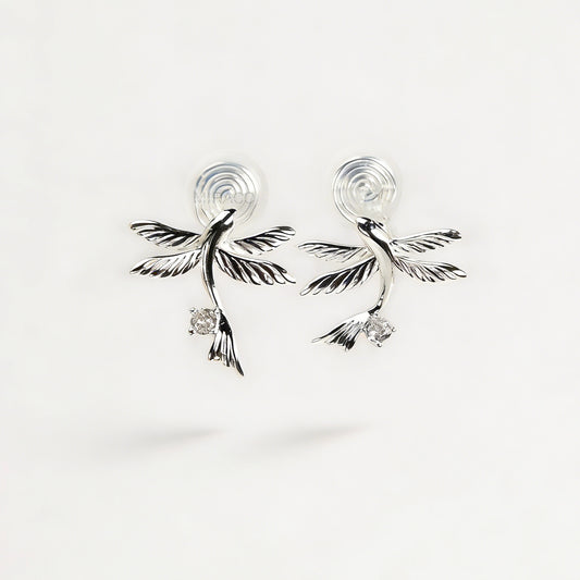Pair of silver-tone bird-shaped clip-on earrings in flight with clear crystals and comfortable invisible coil back closures.