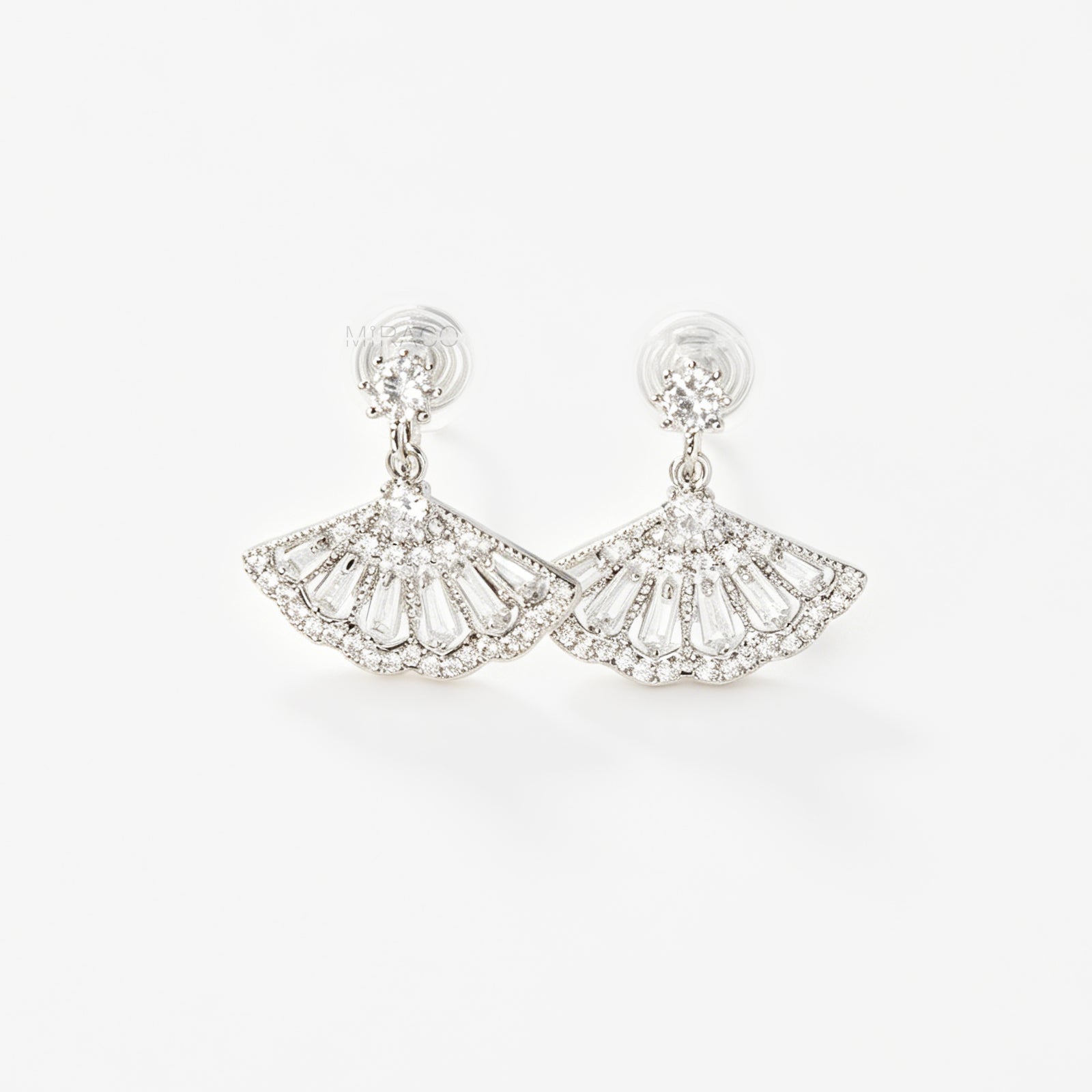 A pair of silver-tone Art Deco style clip-on drop earrings featuring a fan-shaped design set with baguette and round clear crystals, with adjustable coil-spring backs.