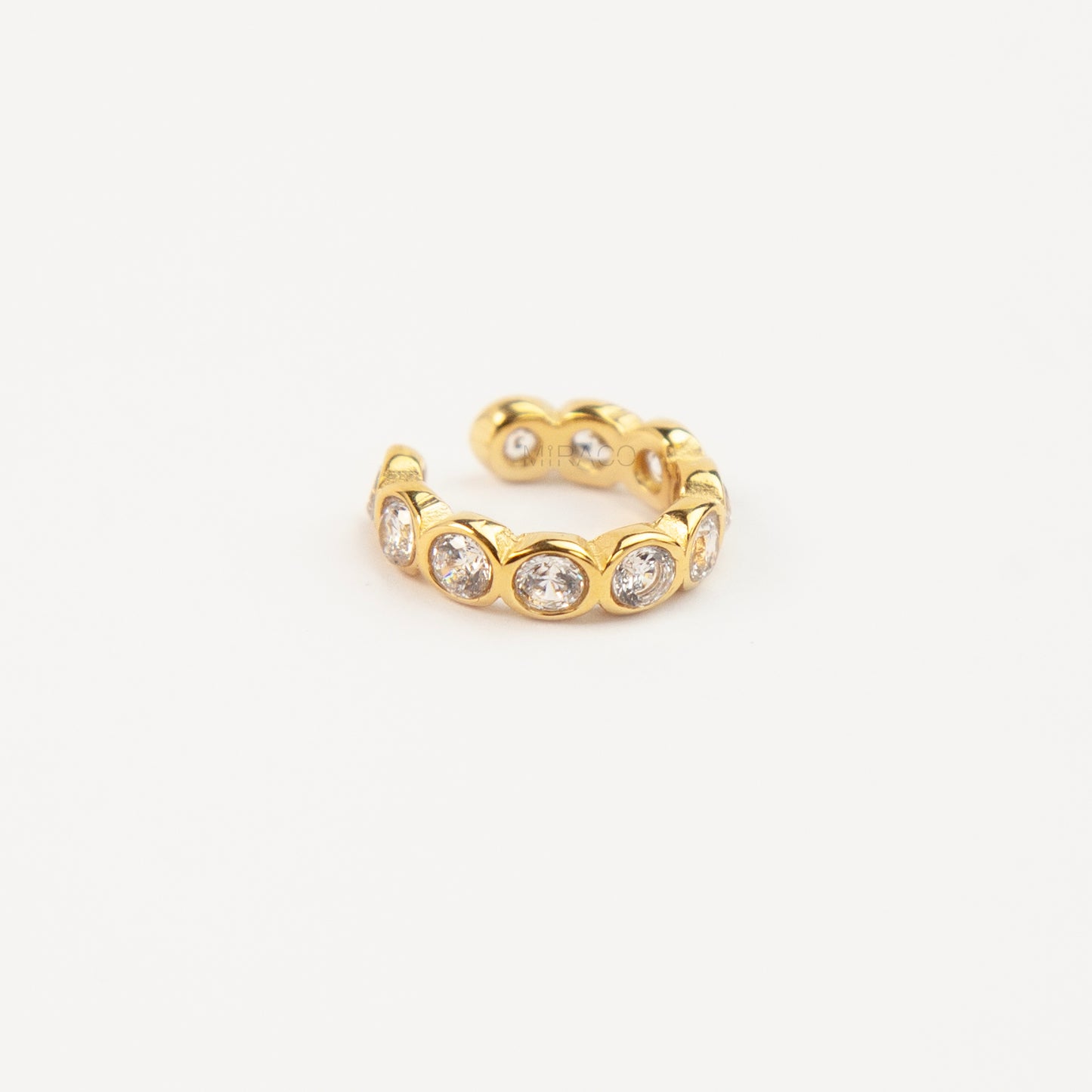 single eternity ear cuffs with bezel-set stones,  gold with clear crystals