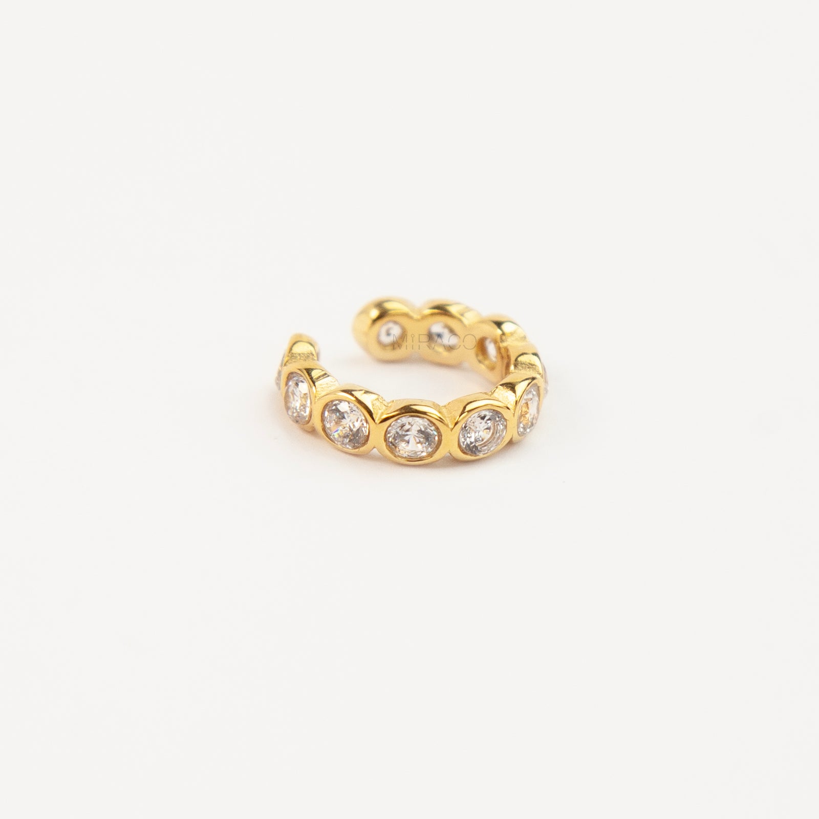 single eternity ear cuffs with bezel-set stones,  gold with clear crystals