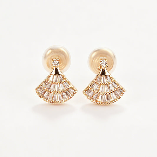 A pair of gold Art Deco fan-shaped clip-on earrings, detailed with tiered baguette crystals and fitted with comfortable coil backs featuring clear comfort cushions.
