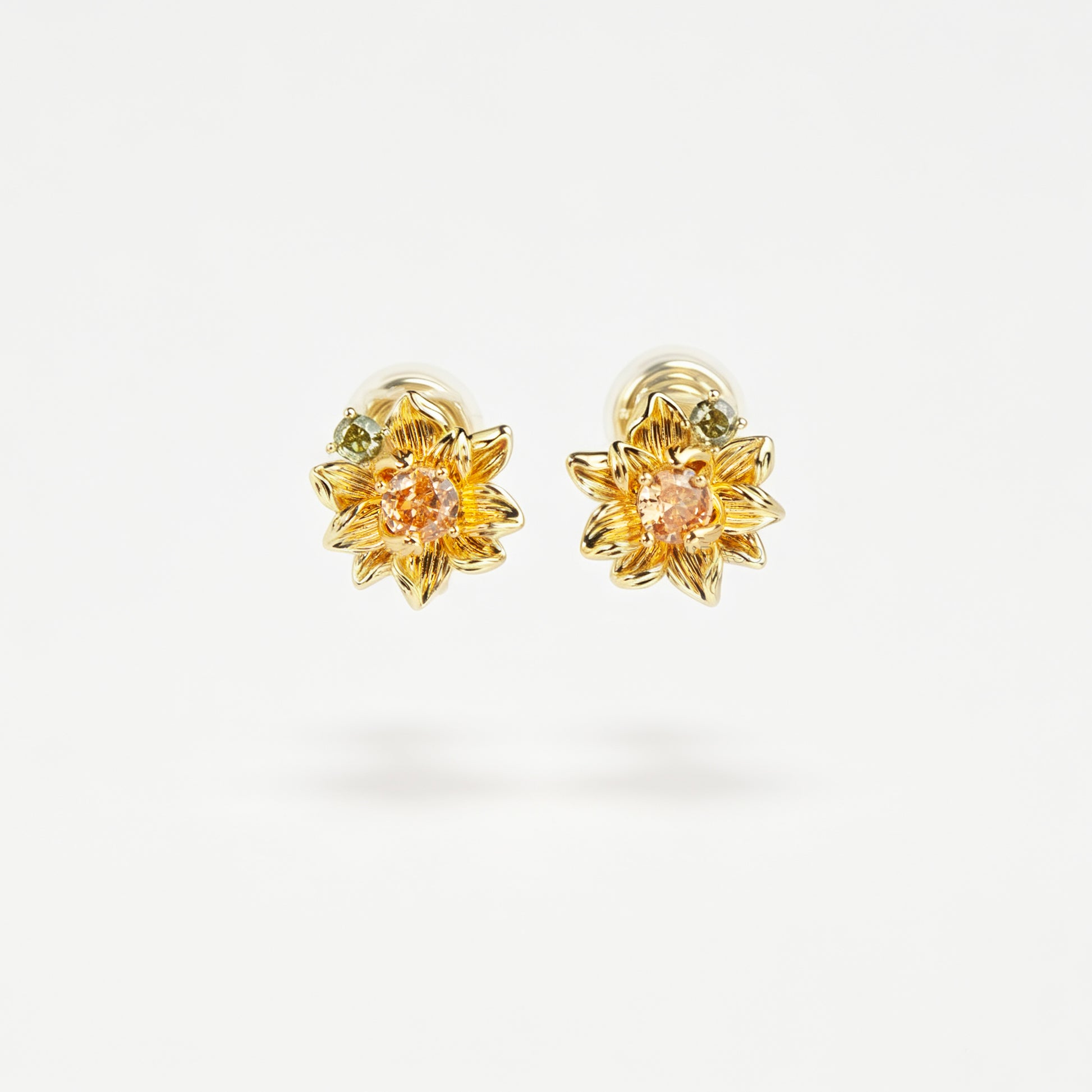 Pair of detailed gold sunflower clip-on stud earrings with amber crystal centers and olive green stone accents