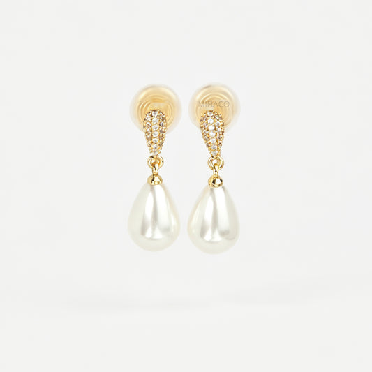 Gold coil-back clip-on drop earrings featuring a pave crystal teardrop stud and dangling white pear-shaped pearl 