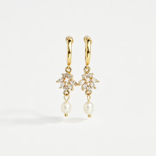 Gold screw-back clip-on hoop earrings with a sparkling cubic zirconia marquise sunburst charm and hanging white pearl drop