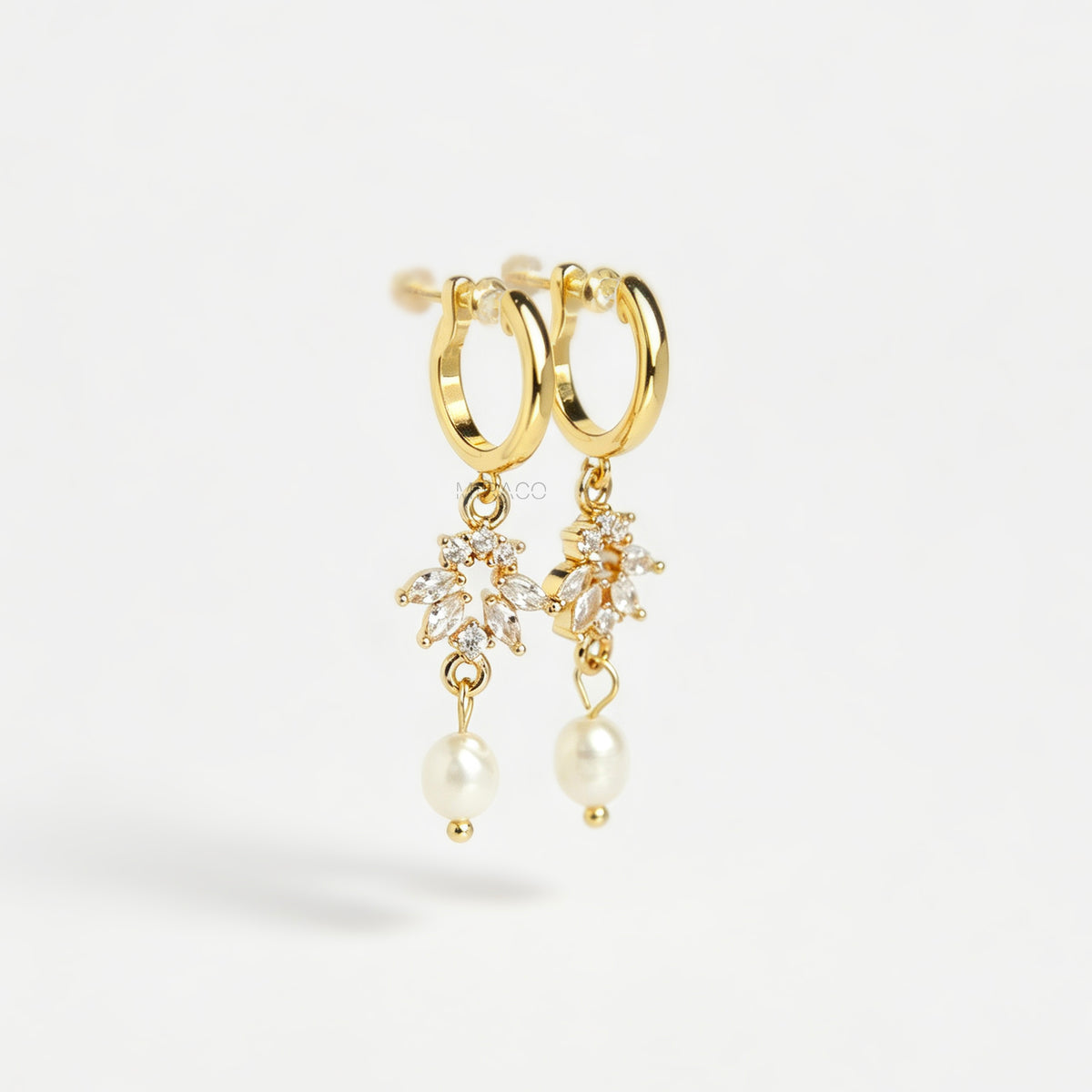 Gold screw-back clip-on hoop earrings with a sparkling cubic zirconia marquise sunburst charm and hanging white pearl drop