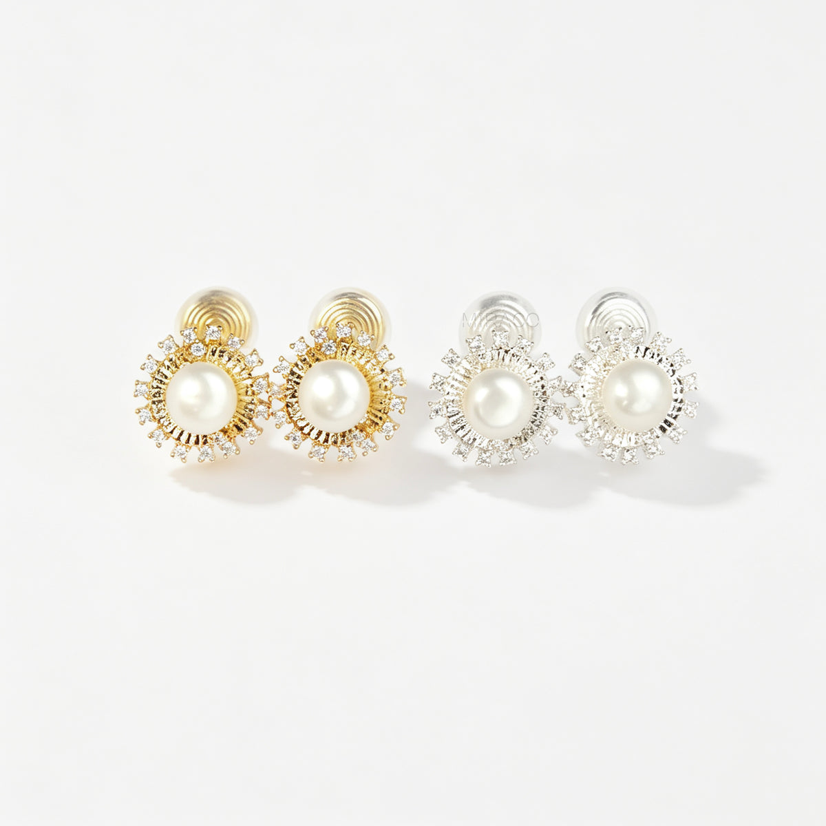 Gold and silver clip-on stud earrings featuring a central freshwater pearl framed by a pavé cubic zirconia sunburst halo with round cushioned coil backs.