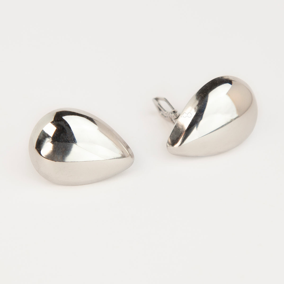 Polished gold and silver teardrop waterdrop clip-on earrings with mini-clip backings displayed side-by-side on a plain white background.