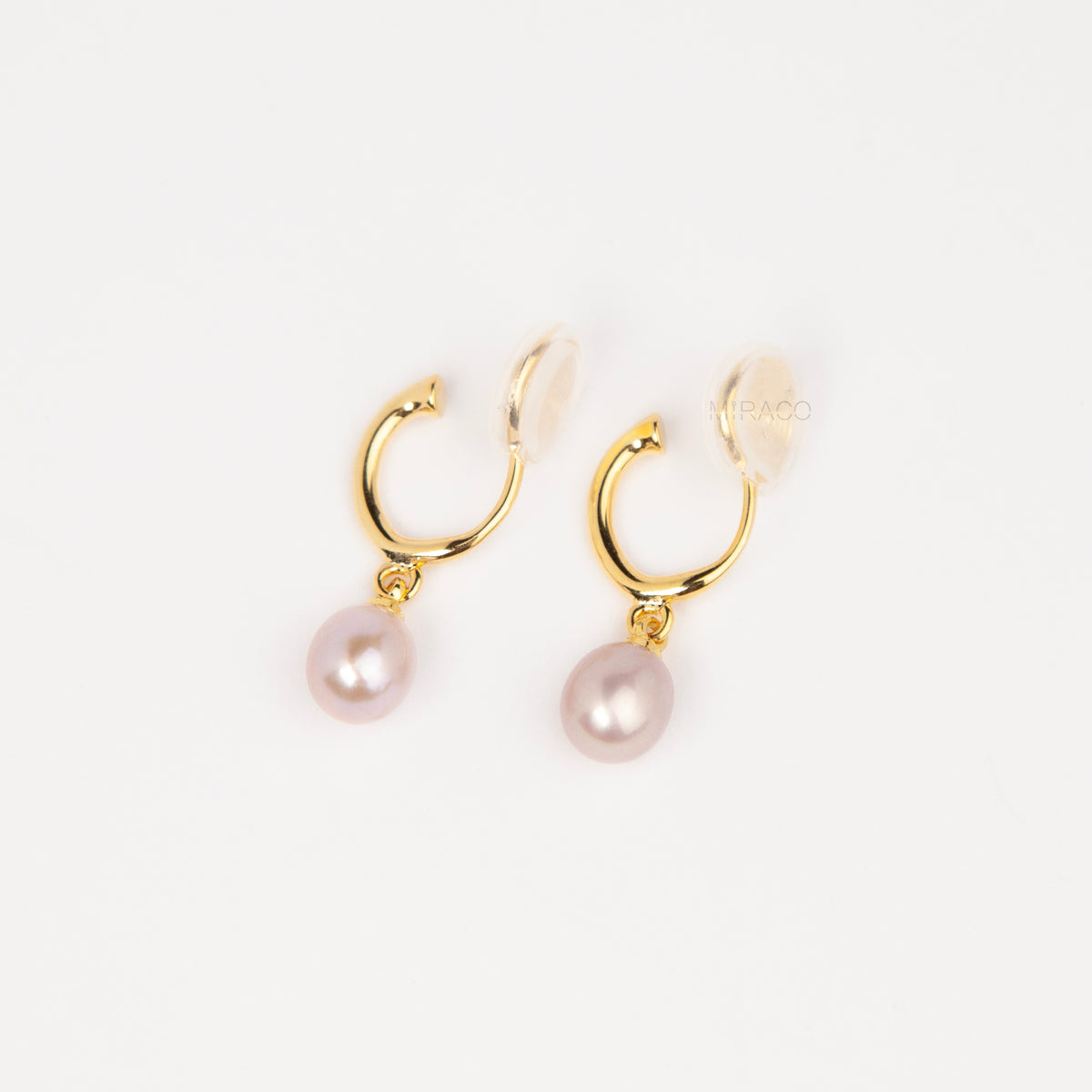 gold clip-on hoop earrings with a teardrop purple freshwater pearl dangle and coil back for non-pierced ears.