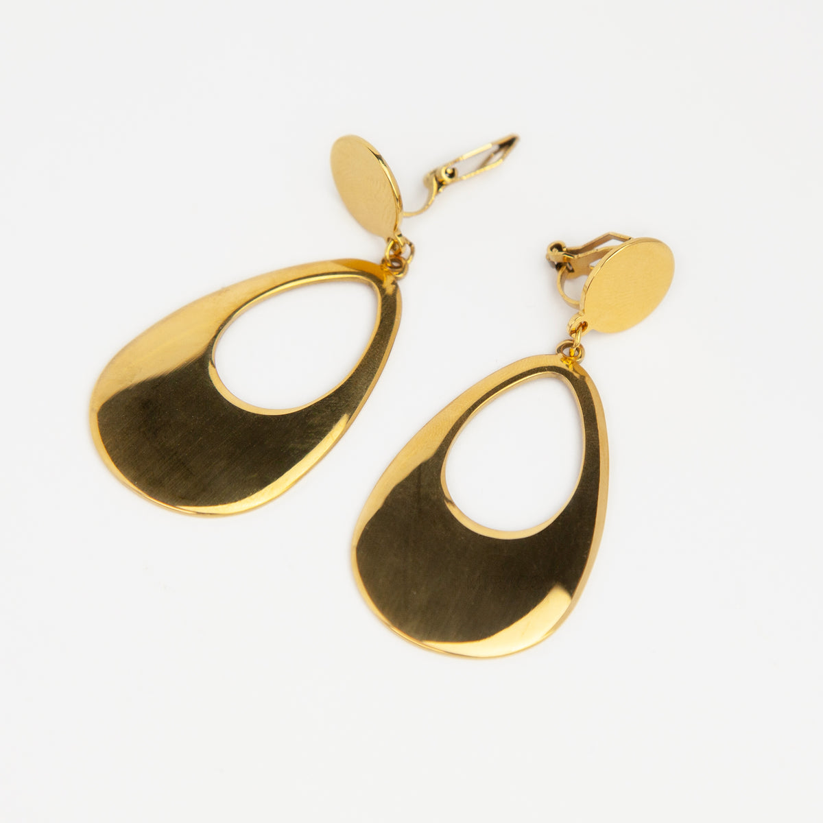 bold gold-plated stainless steel hollow teardrop clip-on dangle earrings with discreet mini-clip backs for non-pierced ears.