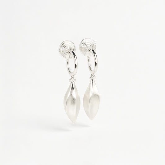 silver clip-on hoop earrings with brushed leaf drop pendants featuring a spring coil back for non-pierced ears.