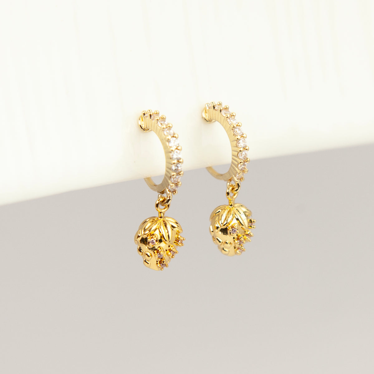 gold-plated strawberry clip-on hoop earrings with pavé cubic zirconia and a comfortable coil back for non-pierced ears.