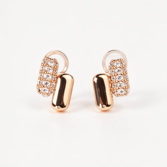 Rose gold clip-on earrings with cushioned round silicon backs, featuring a polished smooth bar and a paved cubic zirconia bar.