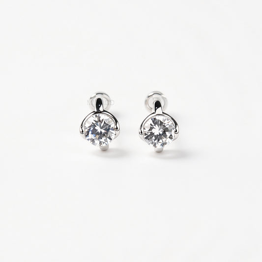 Silver solitaire cubic zirconia clip-on earrings with soft round silicon backings for non-pierced ears.