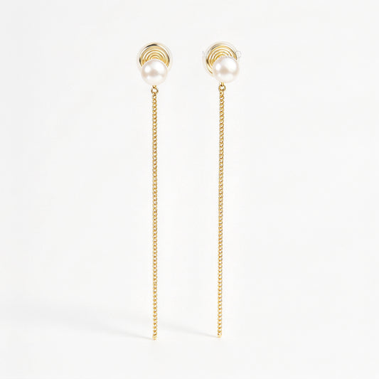 Gold clip-on drop earrings featuring a genuine round freshwater pearl stud with a delicate long chain dangle and invisible coil backs.