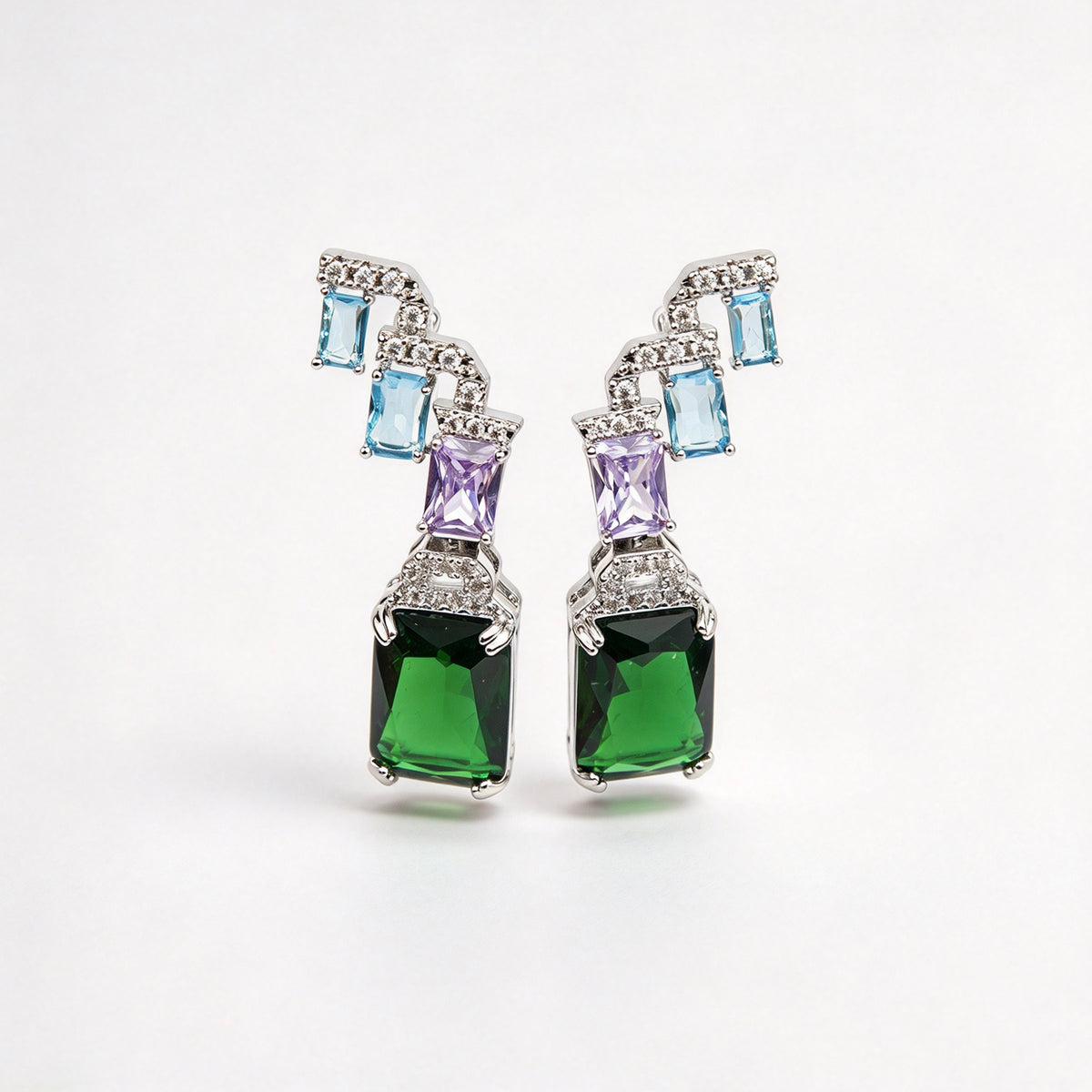 Art deco style multicolor clip-on drop earrings with blue, purple, and green emerald-cut crystals and invisible clear backs.