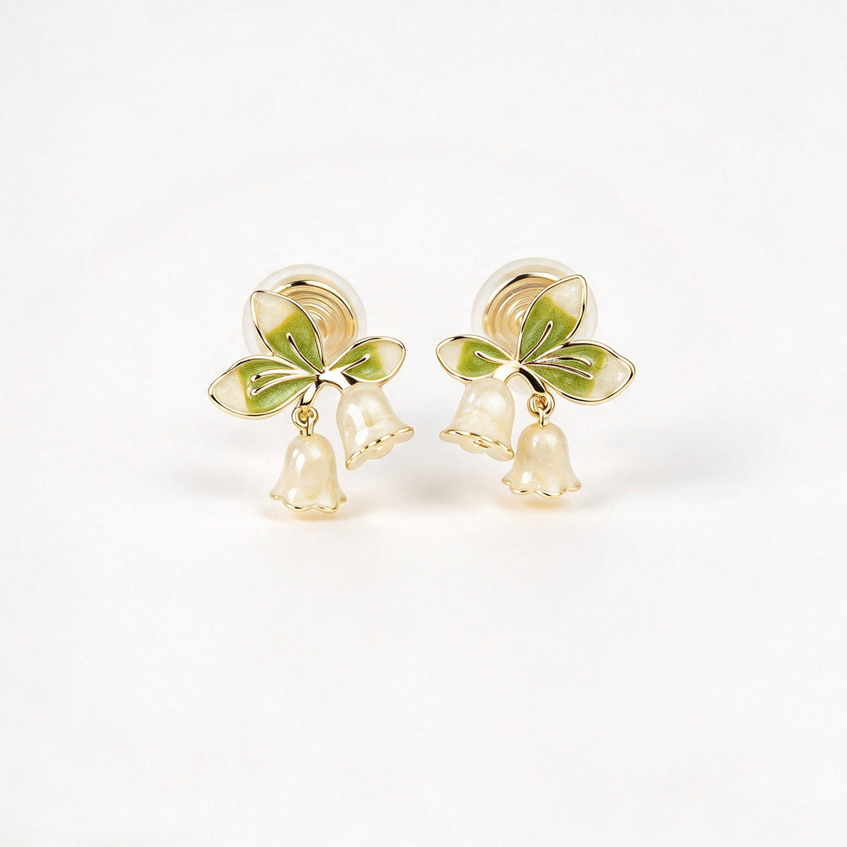 Lily of the Valley floral coil back clip-on earrings with green enamel leaves and pearlescent white flower drops
