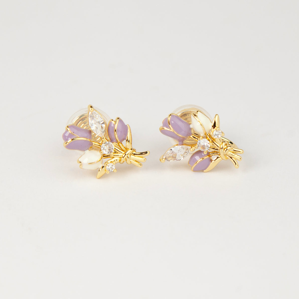 purple and white enamel tulip bouquet clip-on earrings with CZ accents and coil back non-pierced closure in 18K gold plating