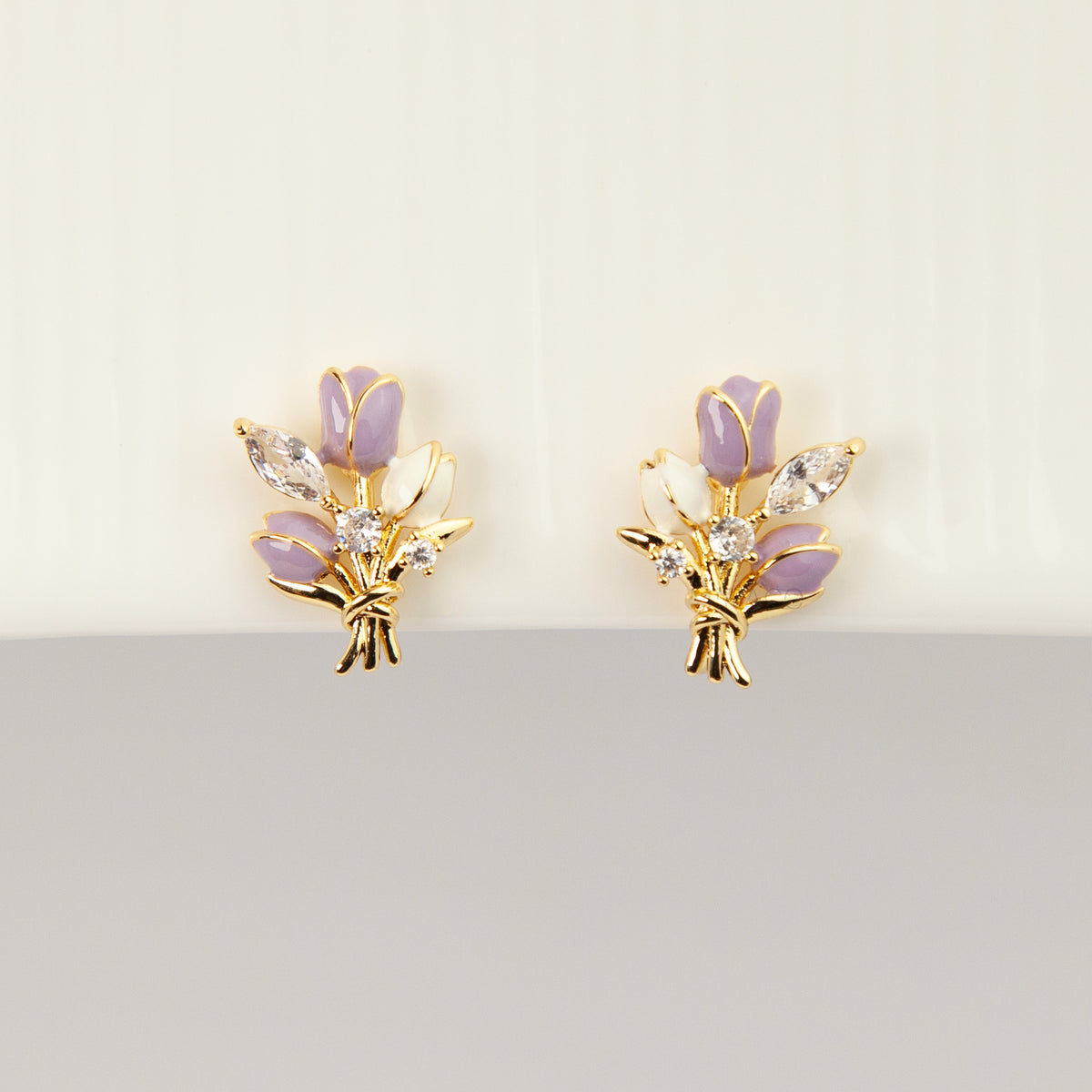 purple and white enamel tulip bouquet clip-on earrings with CZ accents and coil back non-pierced closure in 18K gold plating