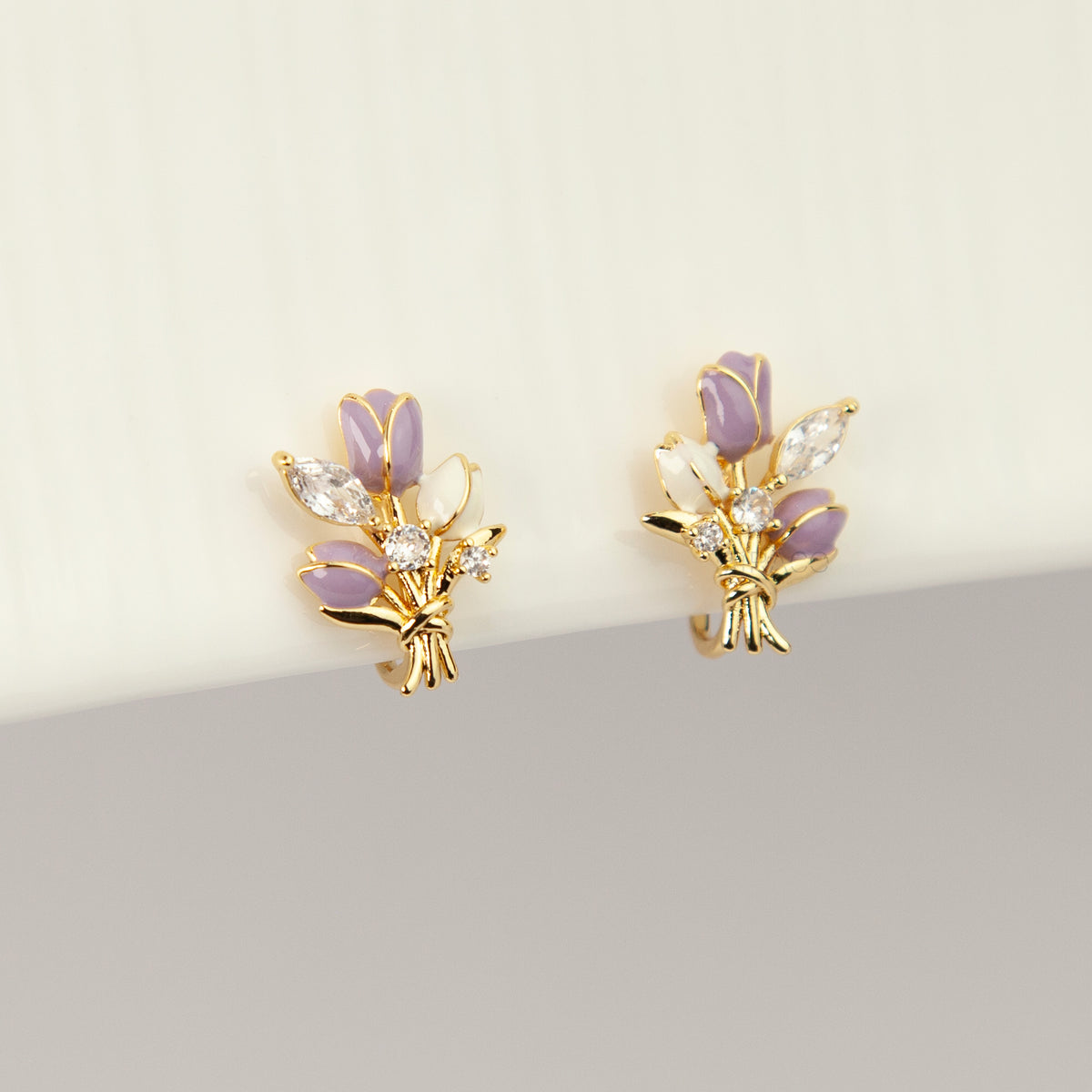 purple and white enamel tulip bouquet clip-on earrings with CZ accents and coil back non-pierced closure in 18K gold plating