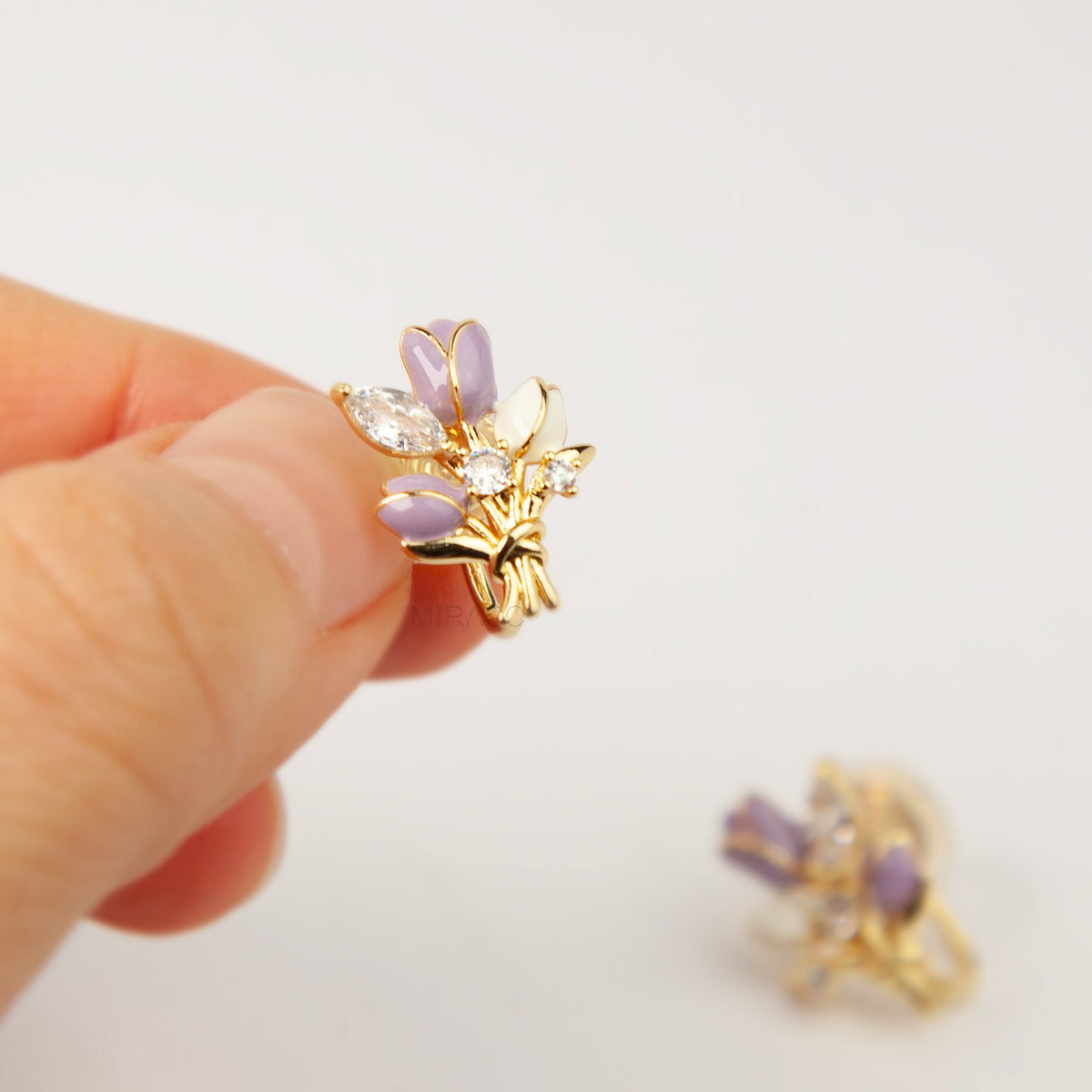 purple and white enamel tulip bouquet clip-on earrings with CZ accents and coil back non-pierced closure in 18K gold plating