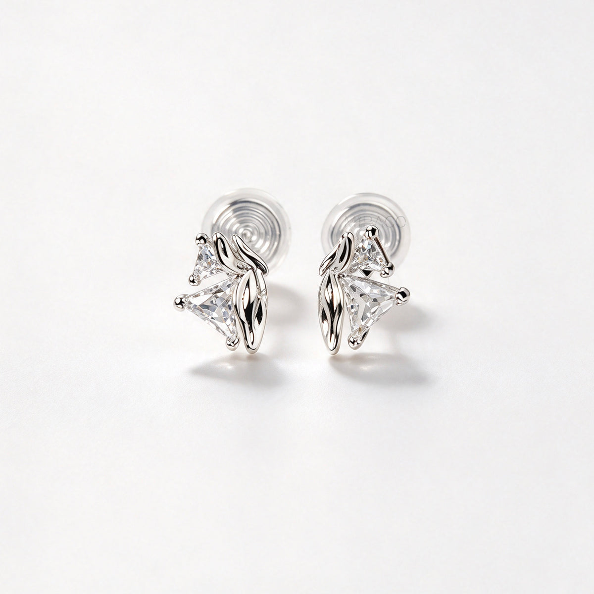 silver geometric clip-on earrings set with trillion-cut cubic zirconia and coil back non-pierced closure