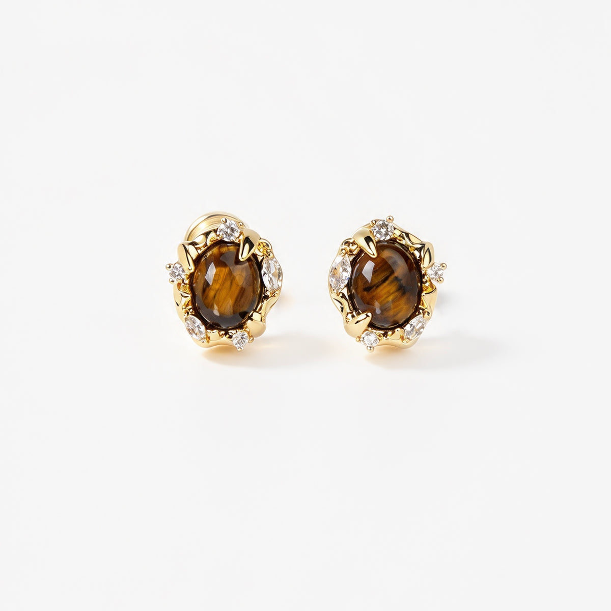 vintage oval tiger's eye cabochon clip-on earrings with cubic zirconia halo accents and coil back non-pierced closure