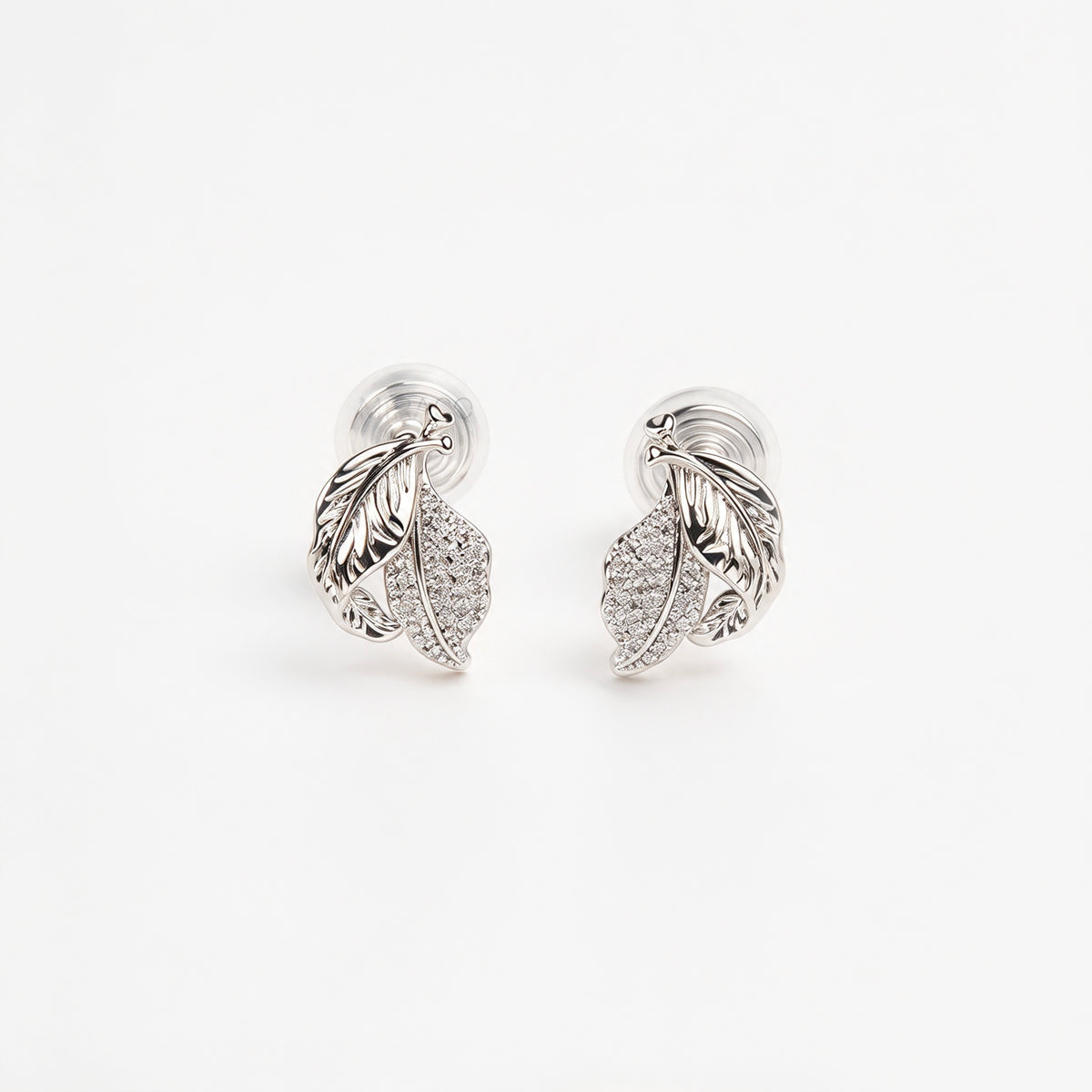 silver pavé crystal feather leaf pendant necklace and matching coil back clip-on earrings for unpierced ears.