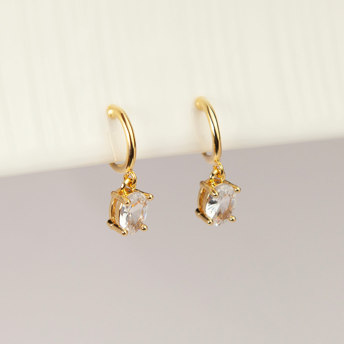 18K gold plated oval solitaire crystal huggie drop clip-on earrings with coil back non-pierced closure