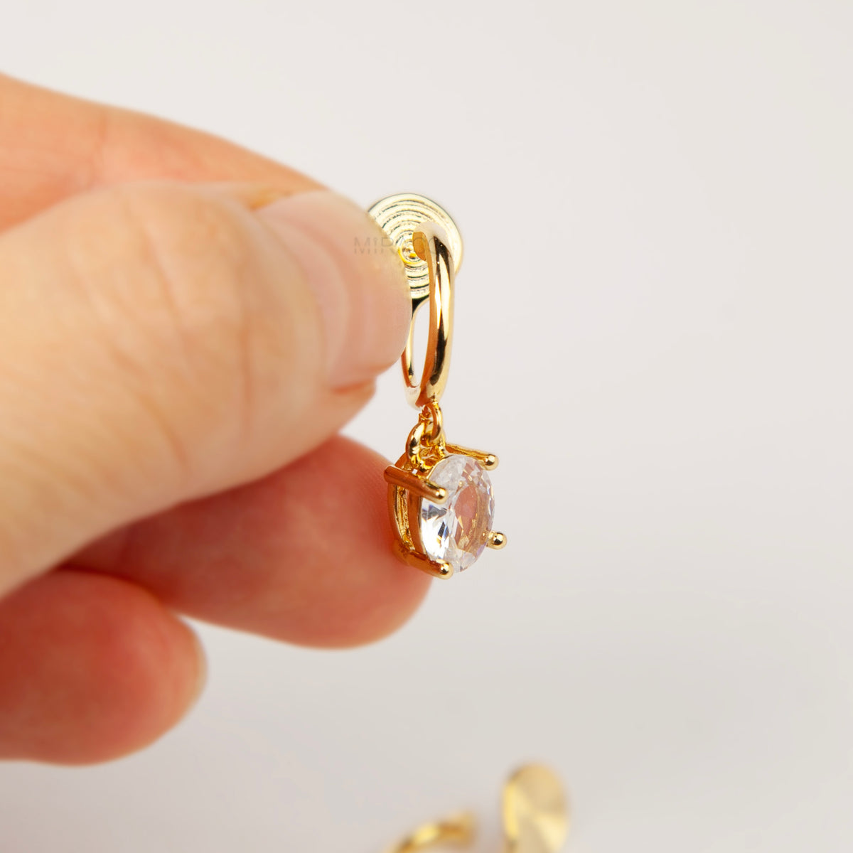18K gold plated oval solitaire crystal huggie drop clip-on earrings with coil back non-pierced closure
