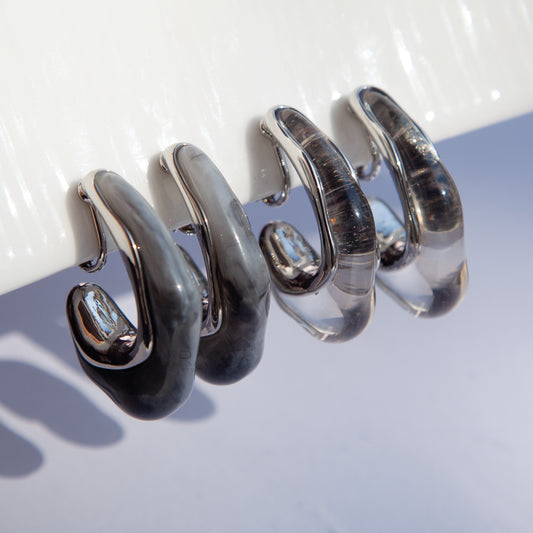 clip-on earrings no piercing
screw back clip-on earrings
silver resin clip-on earrings
stylish earrings for non-pierced ears
molten wave earrings
lightweight clip-on earrings