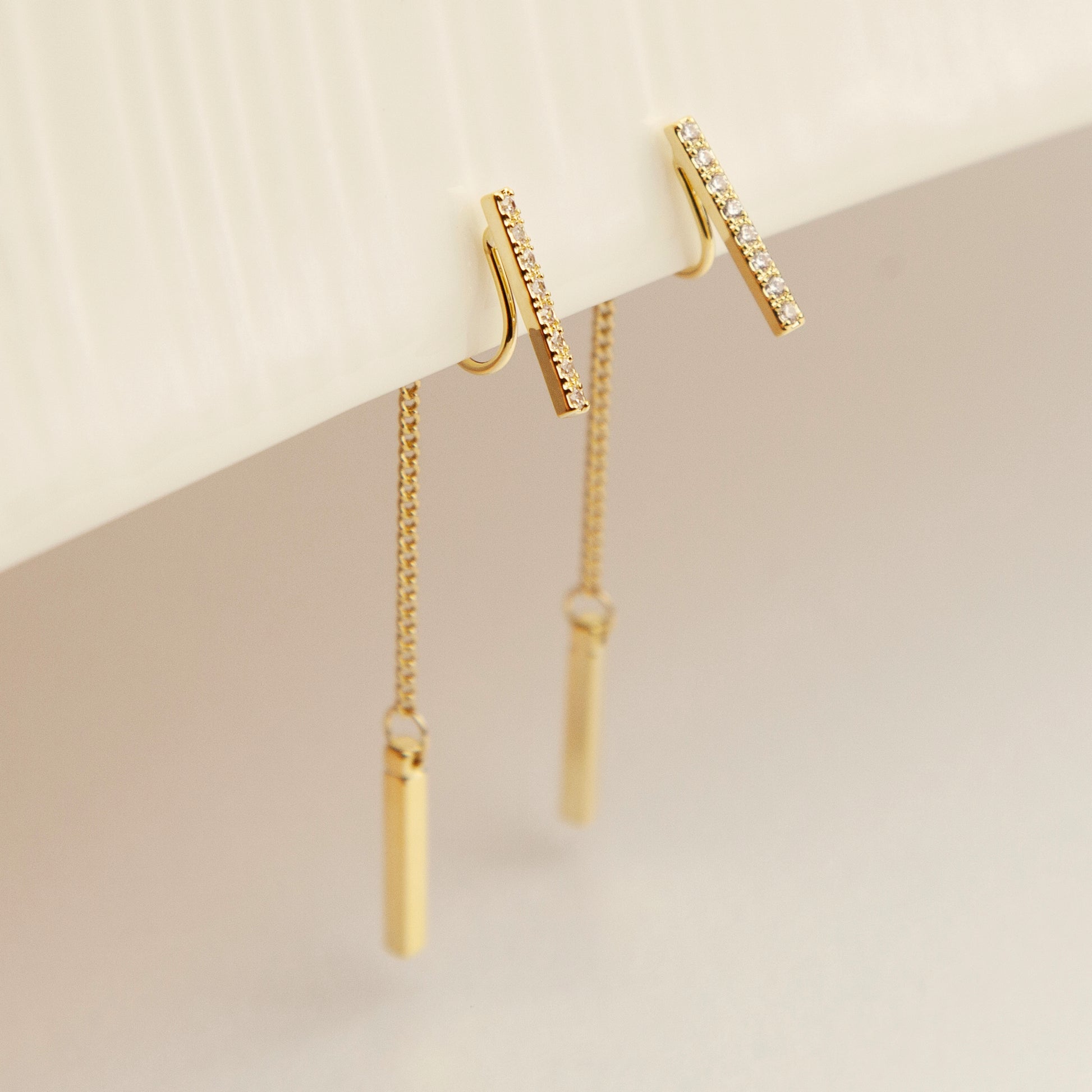 Elegant chain drop clip-on earrings with sparkling pavé crystals. Available in gold or silver, lightweight and comfortable non-pierced earrings perfect for weddings, parties, and everyday chic style.